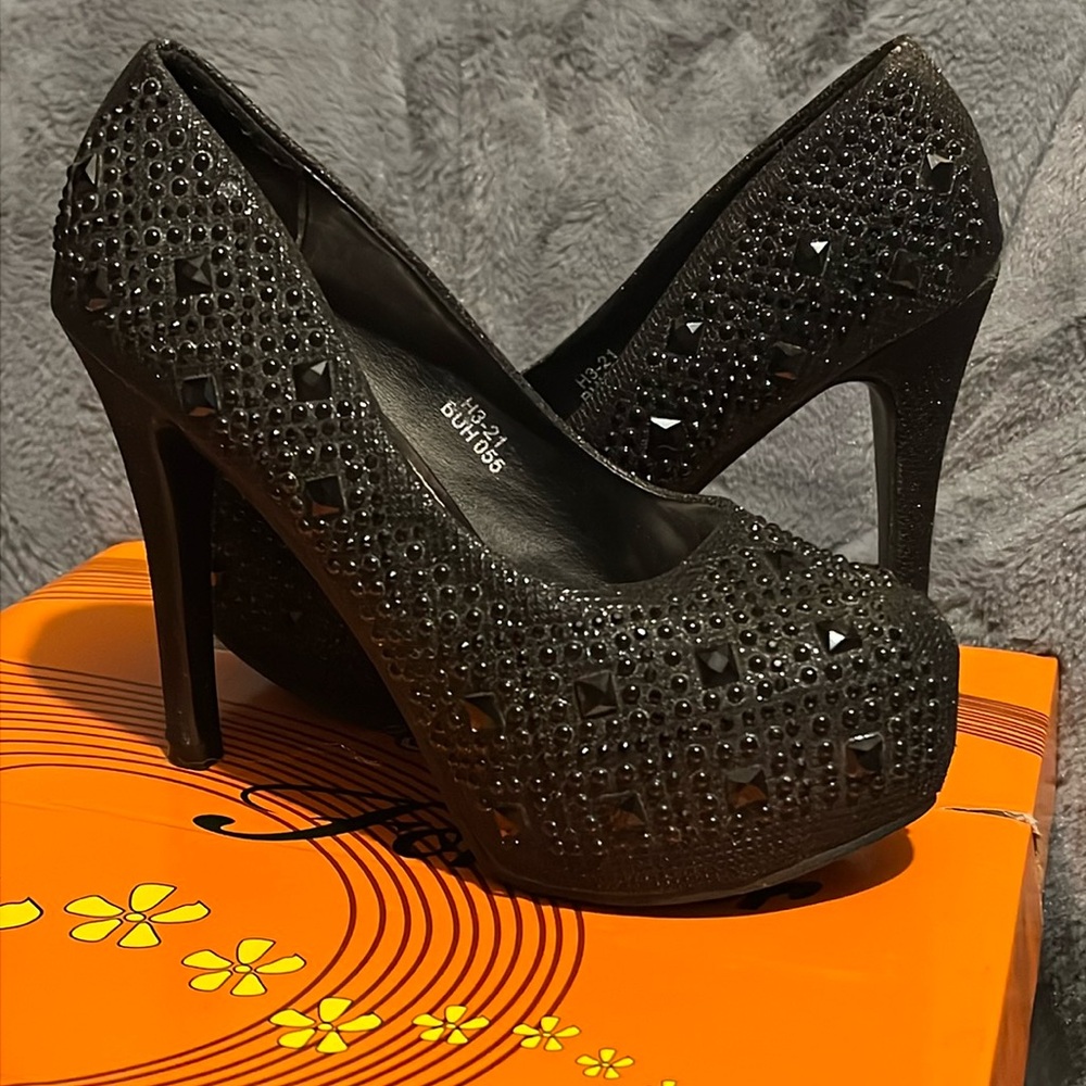 black beaded heels.